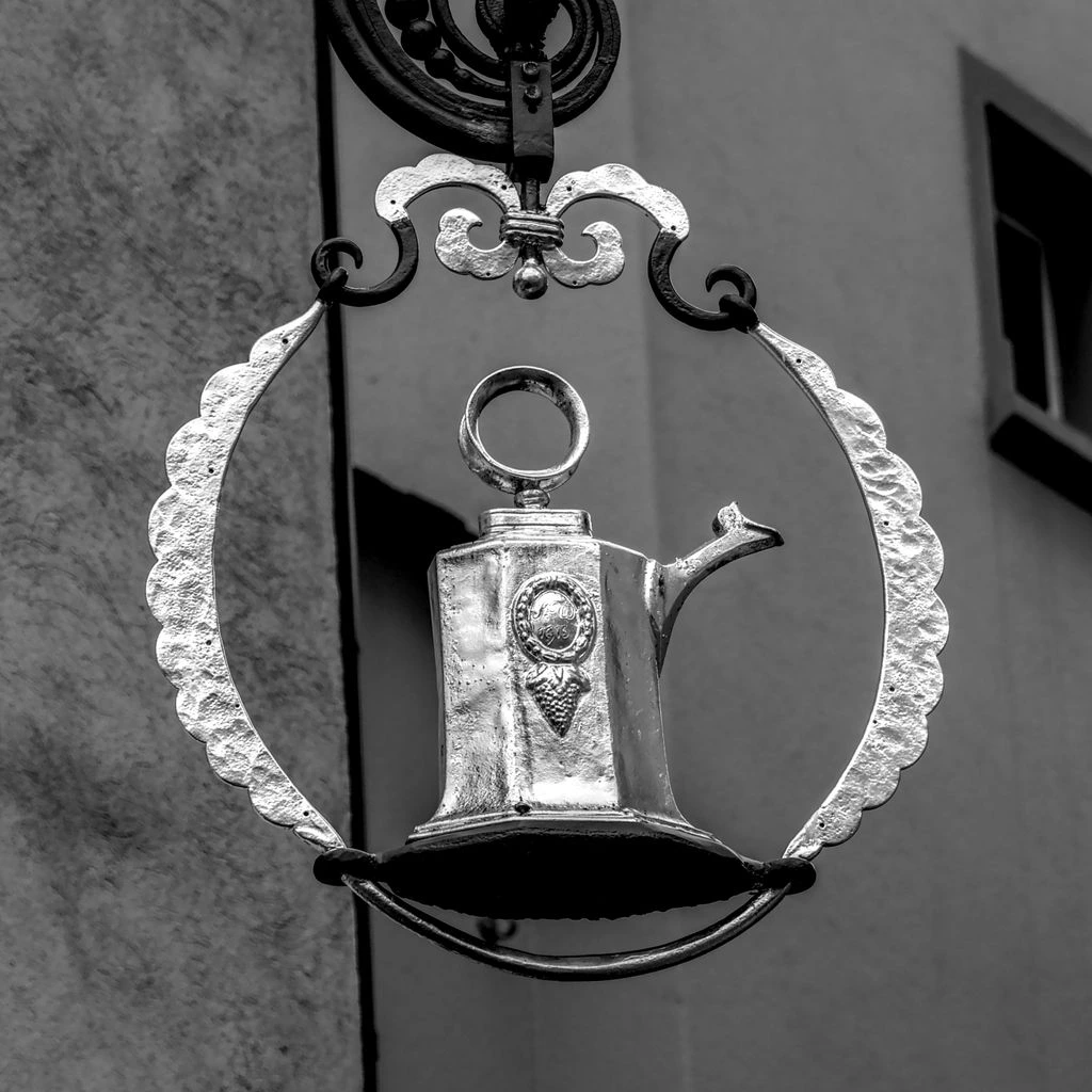 Georgian silver sugar tongs with armorial crest